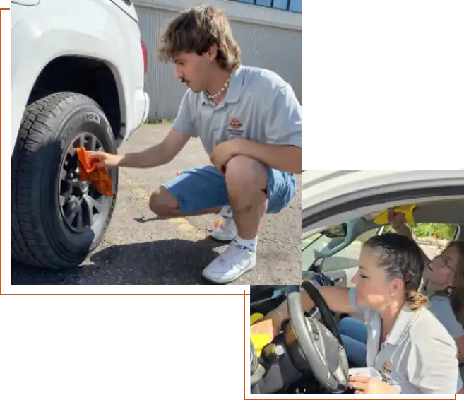 A man and woman working on a car tire.